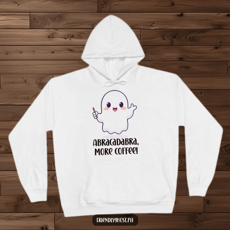 Funny hoodie with a translucent ghost happily waving a tiny, glowing wand, perfect for cozying up with magical flair.