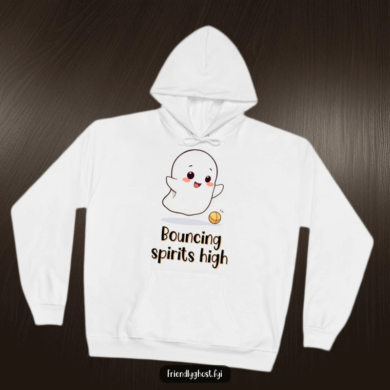 Funny hoodie with a small ghost character mid-bounce, a tiny ball in play, and a wide, mischievous grin all over.
