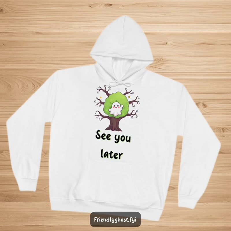 Funny ghost hoodie features a happy ghost waving goodbye from a charmingly spooky tree, perfect for any season.