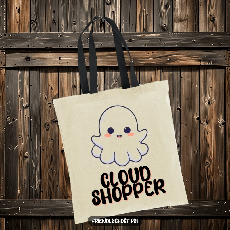 Funny tote bag with a little ghost playfully peeking from behind a cloud, perfect for carrying spectral essentials discreetly.